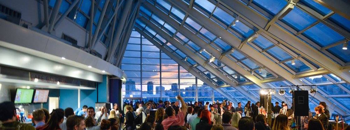 Guests mingle in the Adler's Skyline Solarium at Adler After Dark, a monthly 21+ after-hours event!