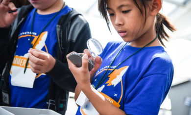 Adler Summer Camp Participant Looking At Space Rock