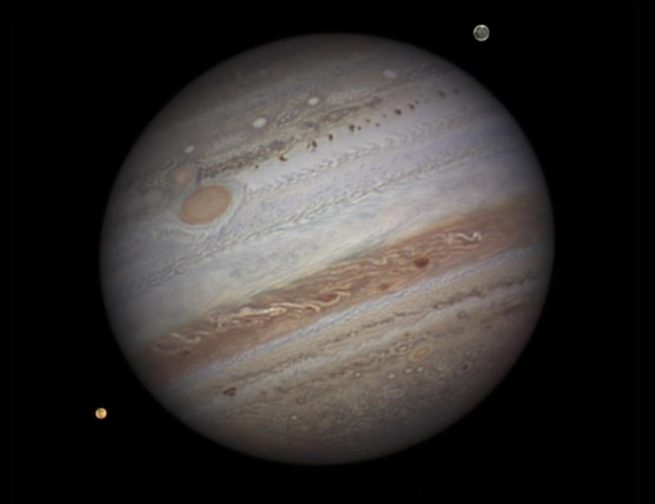 Jupiter and two of its Moons, Io and Ganymede