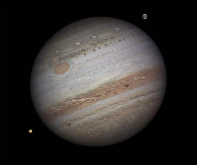 Jupiter and two of its Moons, Io and Ganymede