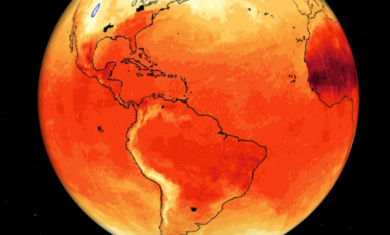 Computer visualization of the western hemisphere of Earth that shows the average air temperature. Most of the globe is colored red or orange, showing a warmer temperature. The far northern edge of the globe, near the Arctic, is colored blue and purple, showing cooler temperatures.