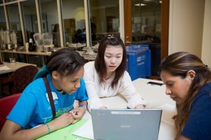 Girls at computer during Adler Hackathon