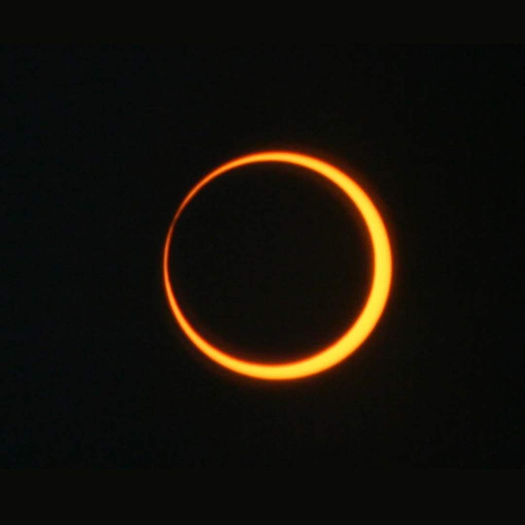 The Moon covering the middle of the Sun, creating a “ring of fire” illusion during an annular solar eclipse.