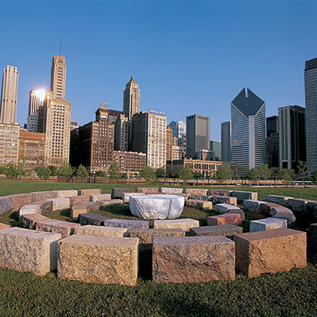 Americas’ Courtyard, installed near the Art Institute of Chicago in 1998. In this iteration of the sculpture, the stones were placed in three concentric circles, as the famous Chicago skyline hovers in the background. Image Credit: Denise Milan