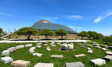 Americas’ Courtyard, a stone sculpture outside the Adler Planetarium in Chicago Illinois on a sunny day.