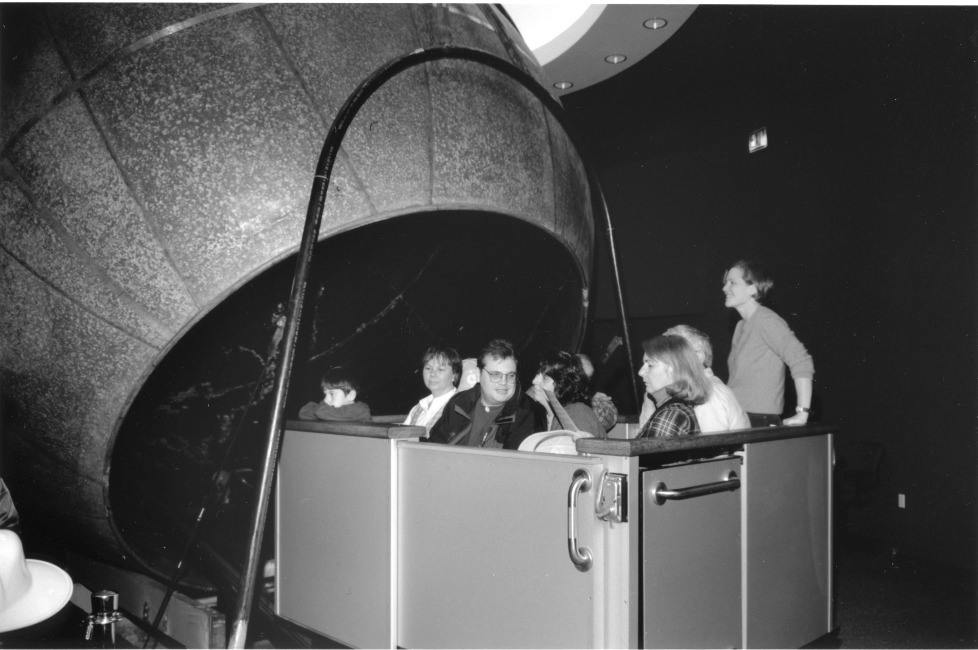 A full carload of visitors is pictured either going into or coming out of the Atwood Sphere.