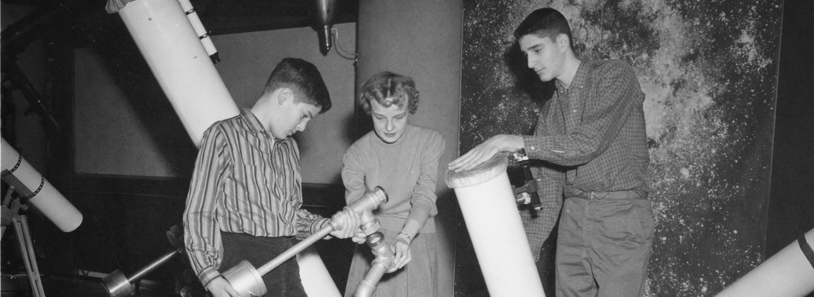 Three students with telescopes