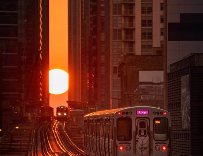 The Sun sets during Chicagohenge as a CTA train in Chicago, Illinois travels towards it. Image Credit: @cdats
