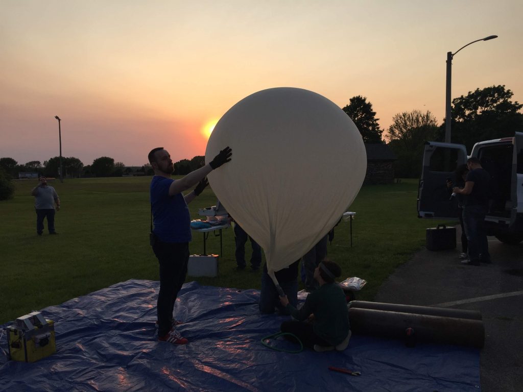  Far Horizons volunteers and staff prepare the balloon that carried the Chicago NITELite mission to the stratosphere on June 2, 2019. 