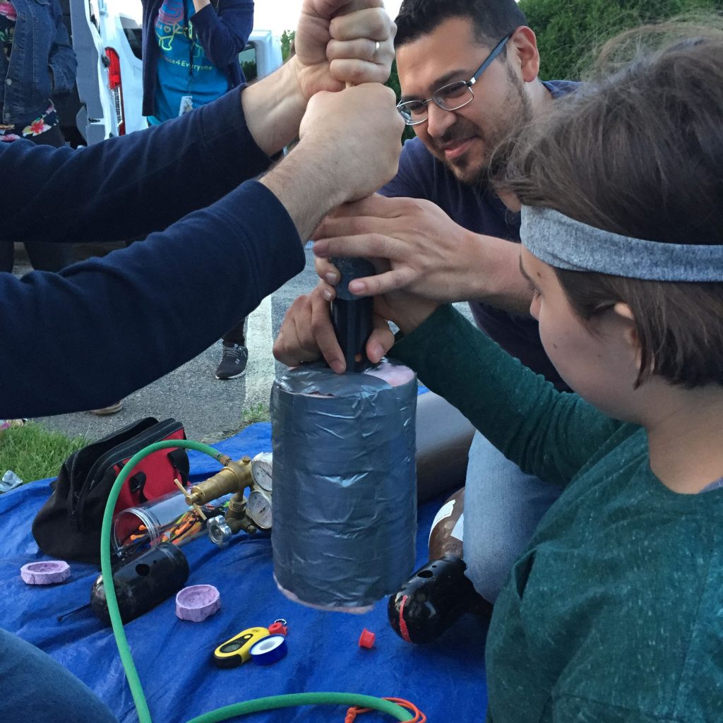 Jesus Garcia, Far Horizons Engineer and Educator, prepares the student built Altitude Control System moments before launch.