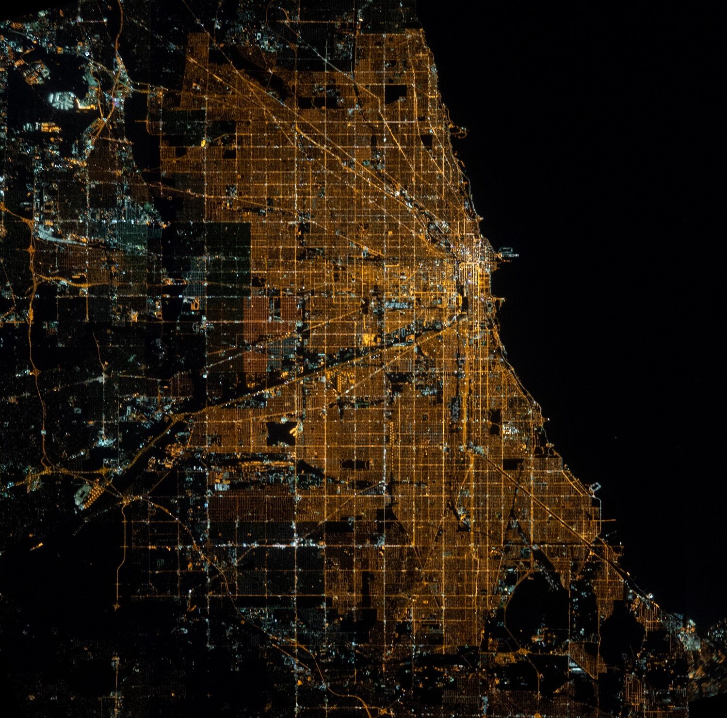 Image Caption: Bird’s eye image of Chicago’s grid taken at night. Image Credit: NASA/ISS