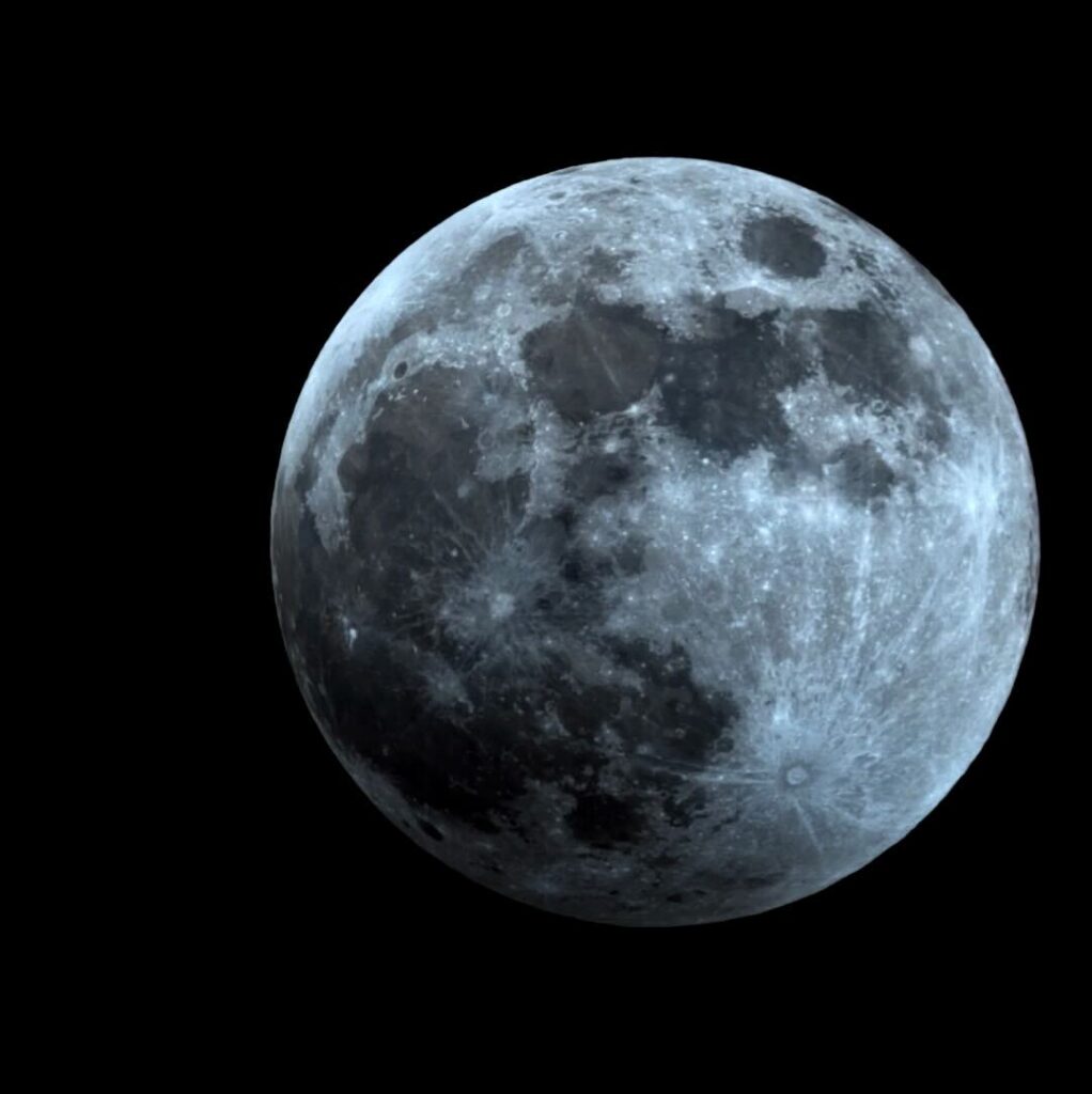 Image caption: The Moon in the Earth’s penumbral shadow during the March 13-14, 2025 lunar eclipse. The Moon shows a slight darkening on its lower-left side. Image credit: Adler Planetarium