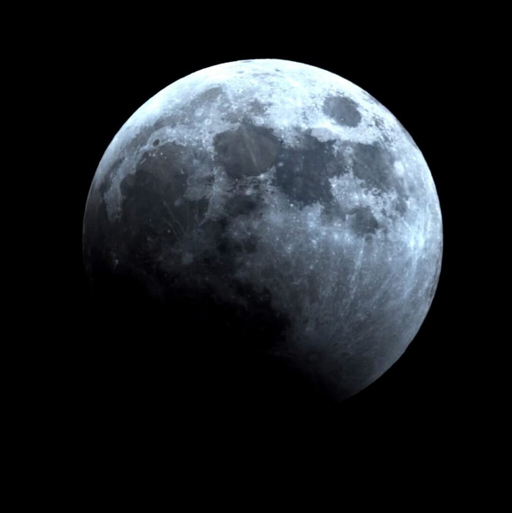 Image Caption: The partially eclipsed Moon during the March 13-14, 2025 lunar eclipse. A dark shadow covers the lower-left section of the Moon. Image credit: Adler Planetarium