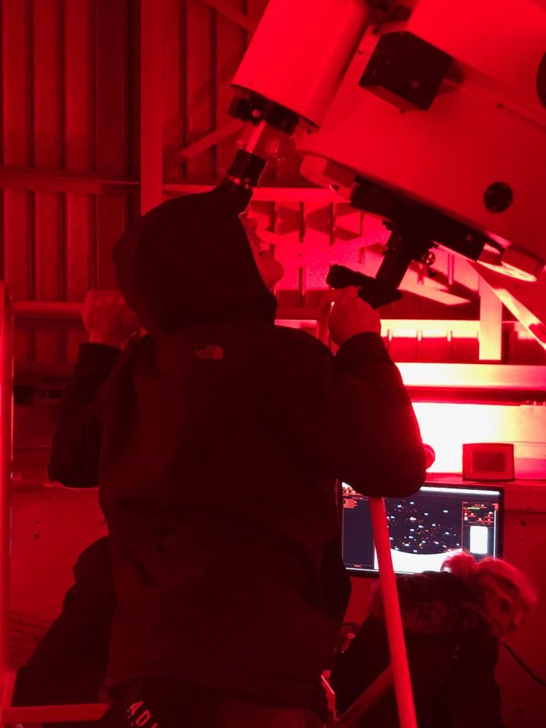 Chicago's own John Cusack enjoys a first look through the newly re-assembled telescope during Adler After Dark on March 21.