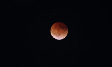 The March 15, 2022 lunar eclipse at totality. The full Moon appears to be brick red in color as the Earth’s shadow covers it.