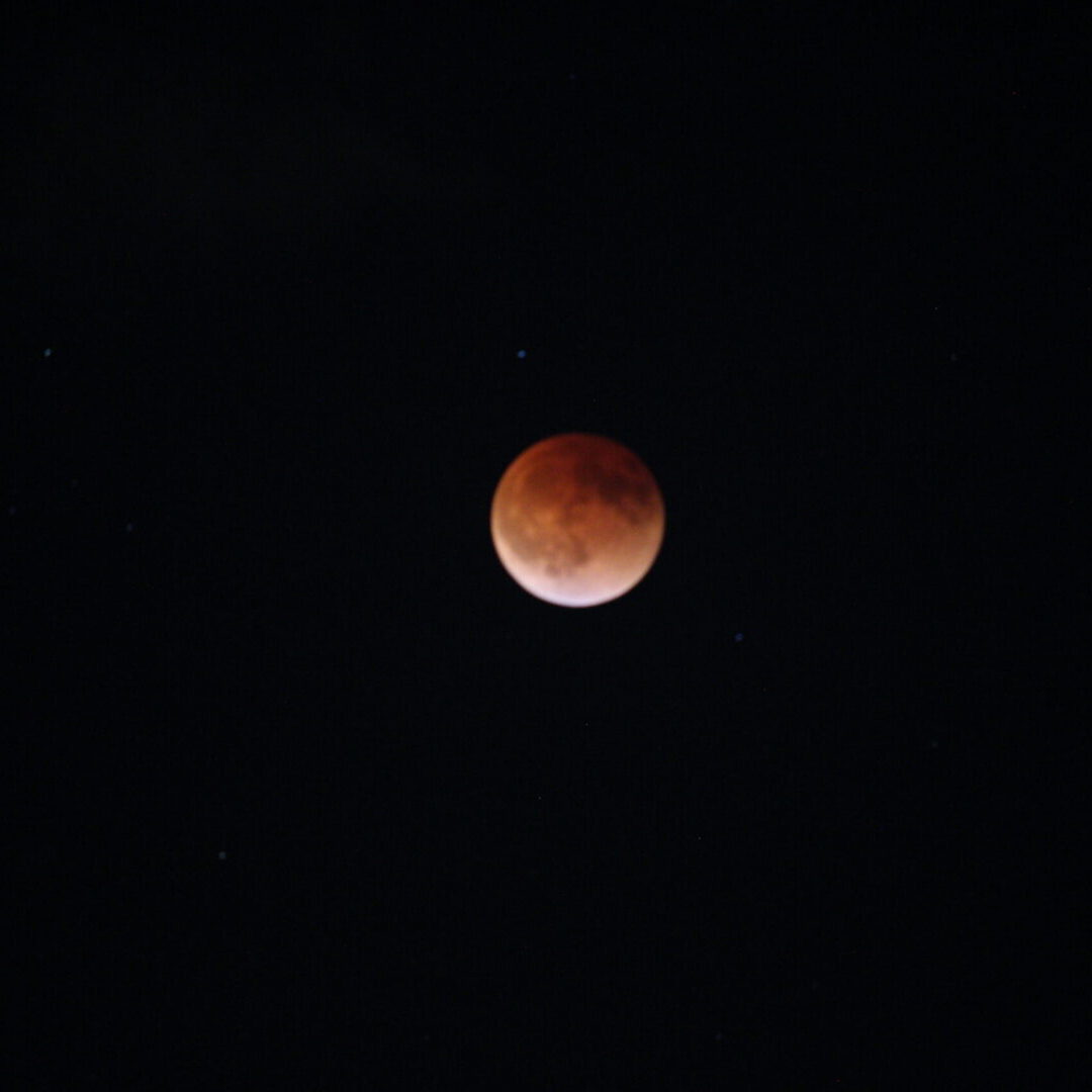 The March 15, 2022 lunar eclipse at totality. The full Moon appears to be brick red in color as the Earth’s shadow covers it.
