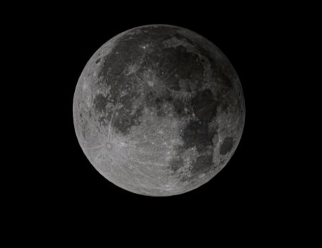 The penumbral lunar eclipse as seen in Sun Valley, Idaho, on November 30, 2020. Image credit: Nils Ribi via Earthsky.org, edited by the Adler Planetarium.