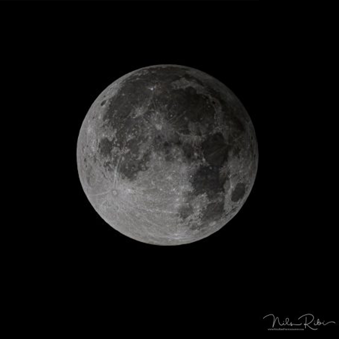 The penumbral lunar eclipse as seen in Sun Valley, Idaho, on November 30, 2020. Image credit: Nils Ribi via Earthsky.org, edited by the Adler Planetarium.