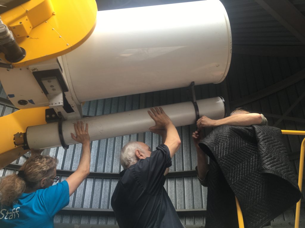 Michelle (left) and crew in the process of removing the mirrors from the telescope, September 2018.