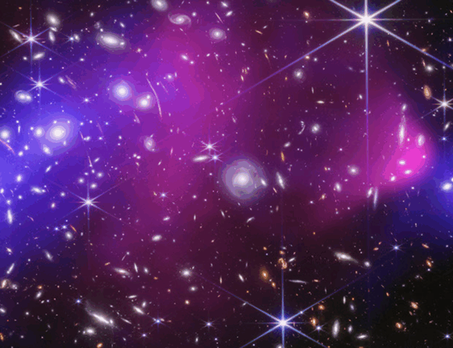 This is the central region of the Bullet Cluster, which is made of two massive clusters of galaxies. X-rays captured by NASA’s Chandra X-ray Observatory are colored pink. The blue represents dark matter precisely mapped by researchers using JWST.