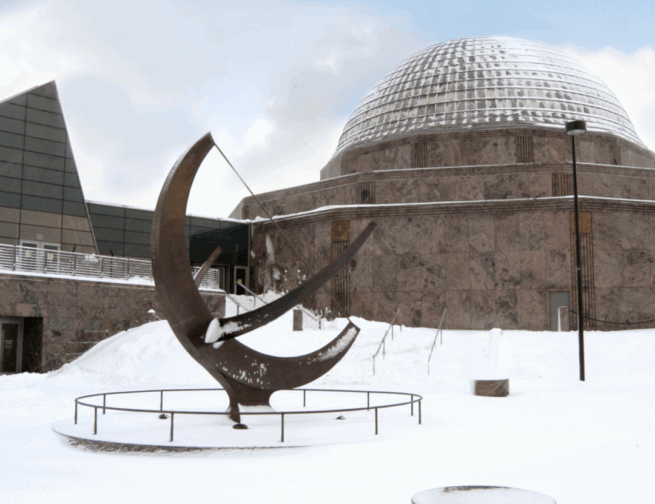 Snow covered outside shot of the Adler Planetarium