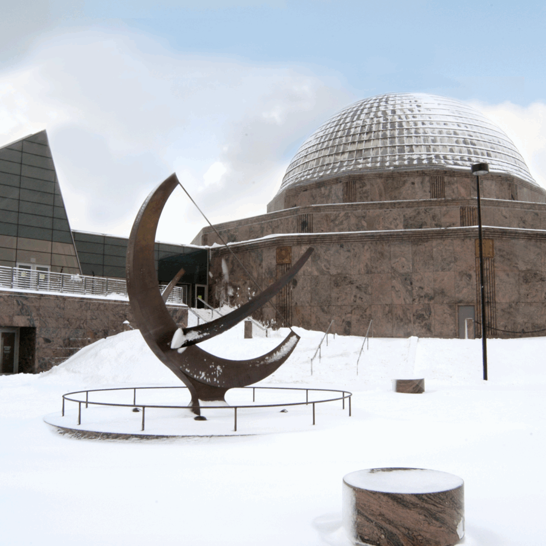 Snow covered outside shot of the Adler Planetarium