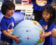 Adler summer campers playing with an inflatable globe.