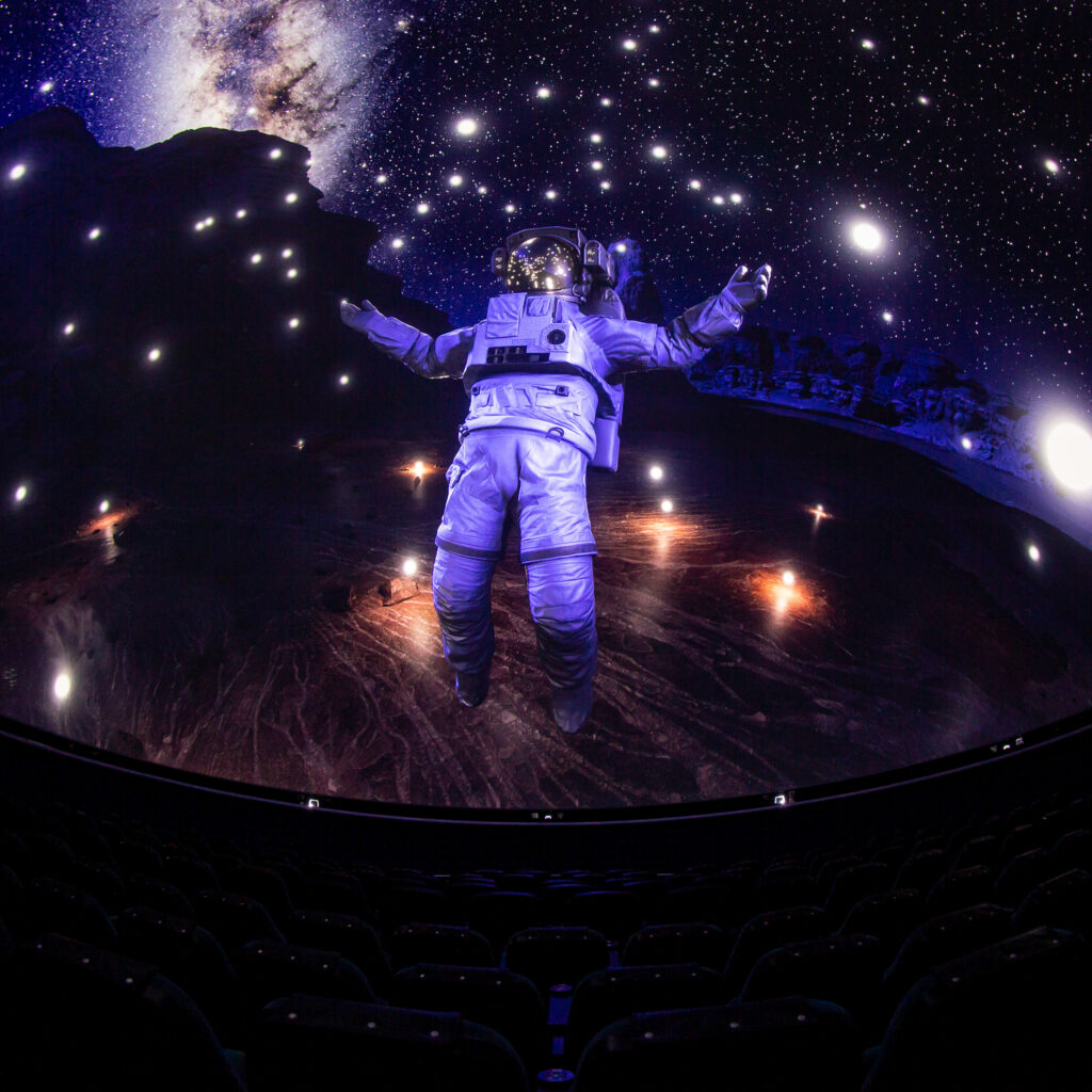 Dome theater screen showing an astronaut floating in space as part of The Dark Side Of The Moon show.