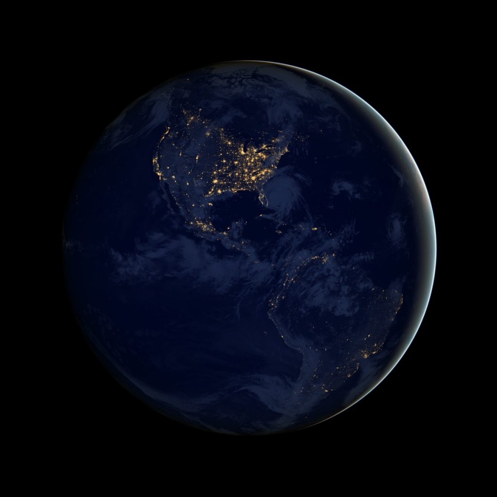 The Earth as seen at night, aka “The Black Marble.” Photo Credit: NASA Earth Observatory image by Robert Simmon, using Suomi NPP VIIRS data provided courtesy of Chris Elvidge