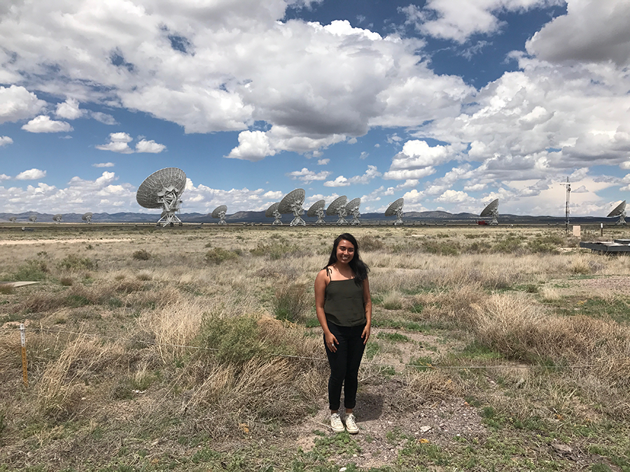 Theresa Melo in a field of satellites