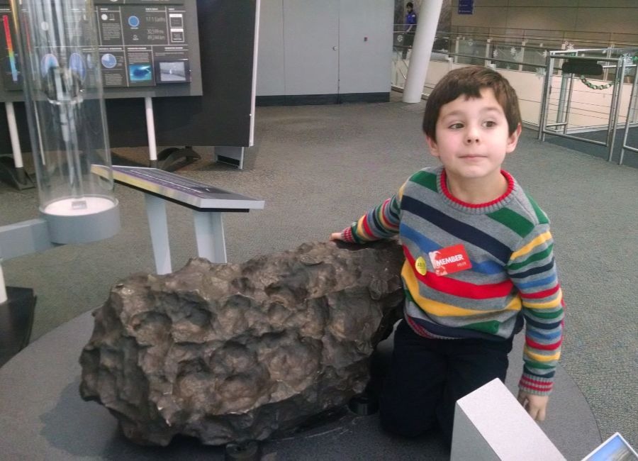 Hudson touching a real meteorite in 2014