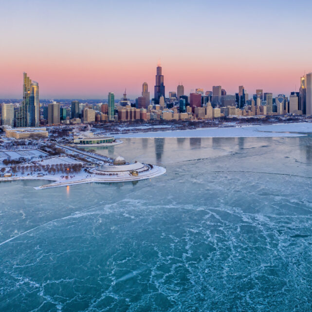 Aerial shot of the Adler Planetarium overlooking the city of Chicago