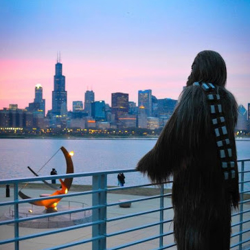 Chewbacca standing outside the Adler Planetarium looking out at the Chicago skyline during an Adler After Dark event. Image Credit: Katie Sater