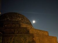 The Adler Planetarium with the Moon, Jupiter and Saturn in the background.