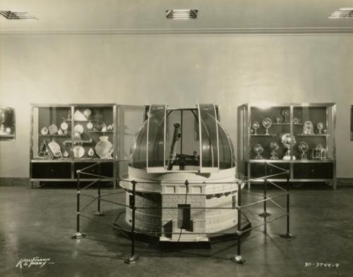 Model observatory and two display cases in an exhibit at the Adler Planetarium, c. 1933