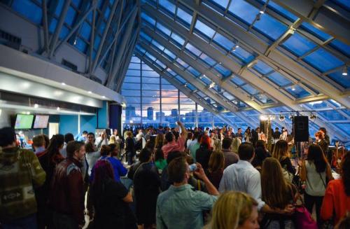 Guests mingle in the Adler's Skyline Solarium at Adler After Dark, a monthly 21+ after-hours event!