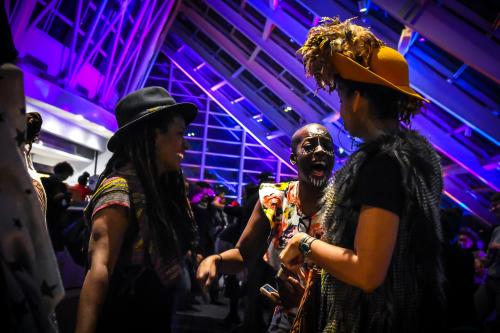 An image of three "Adler After Dark" guests, laughing and conversing.
