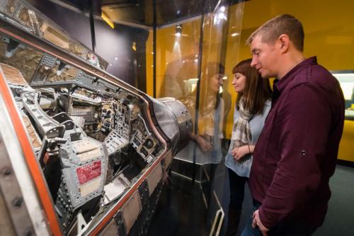 Guests viewing the Gemini 12 spacecraft in the Adler's exhibit, "Mission Moon."