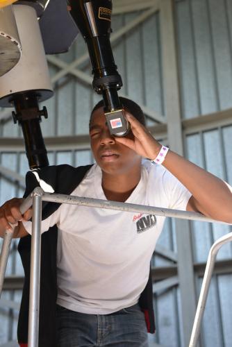 An image of an Adler guest, telescope observing in the Doane Observatory.