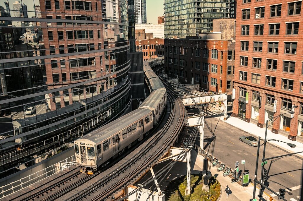 The Chicago Transportation Authority’s “L” train, traveling between skyscrapers in downtown Chicago. Image credit: Photo by Ramapasha Laksono