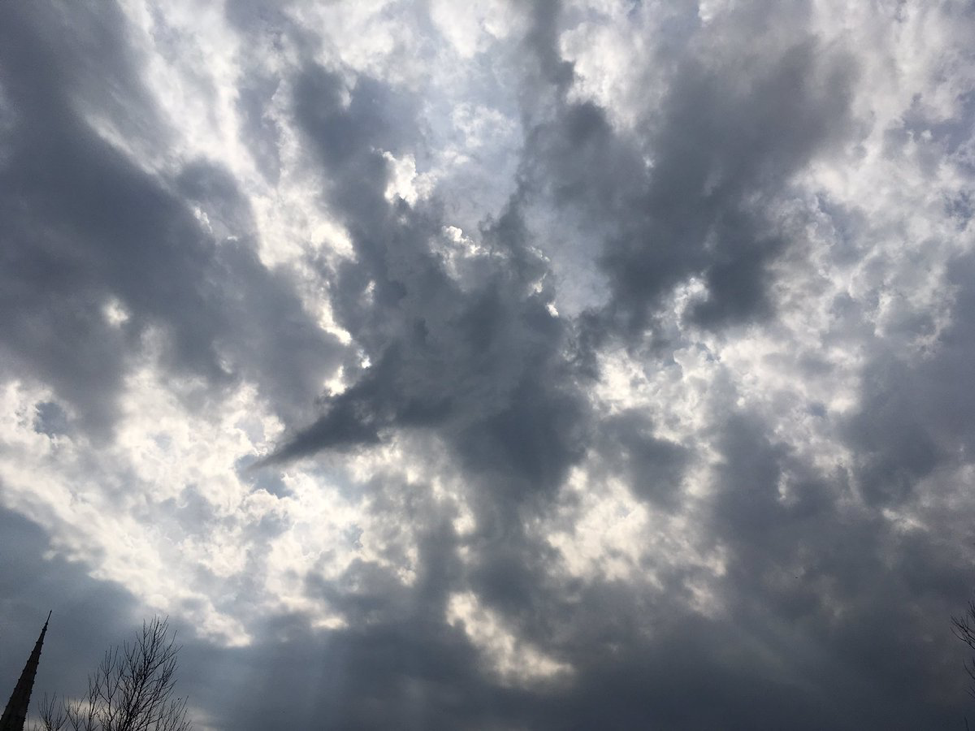 Image of a cloudy sky with a cloud formation that looks like a 5 point star.